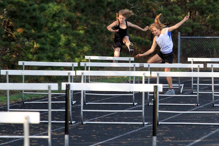 Julia Reagan Rose Engler jumping hurdles