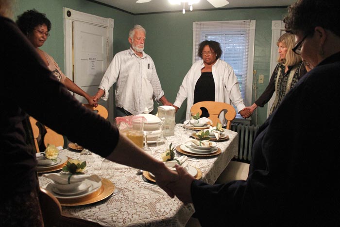Abigail West Tony dinner table dining room praying