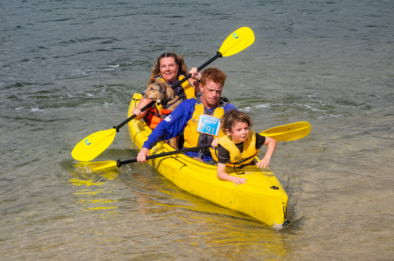  Devin and Kristen Araujo of Edgartown with dog Benny and Kian Stapleton at the bow.