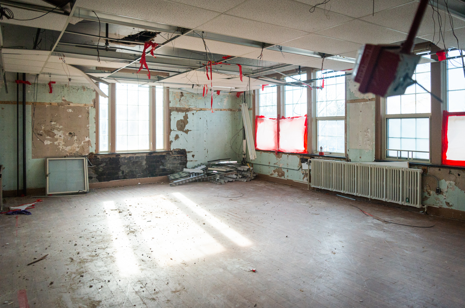 Bright red tape is used everywhere to guide demolition efforts.