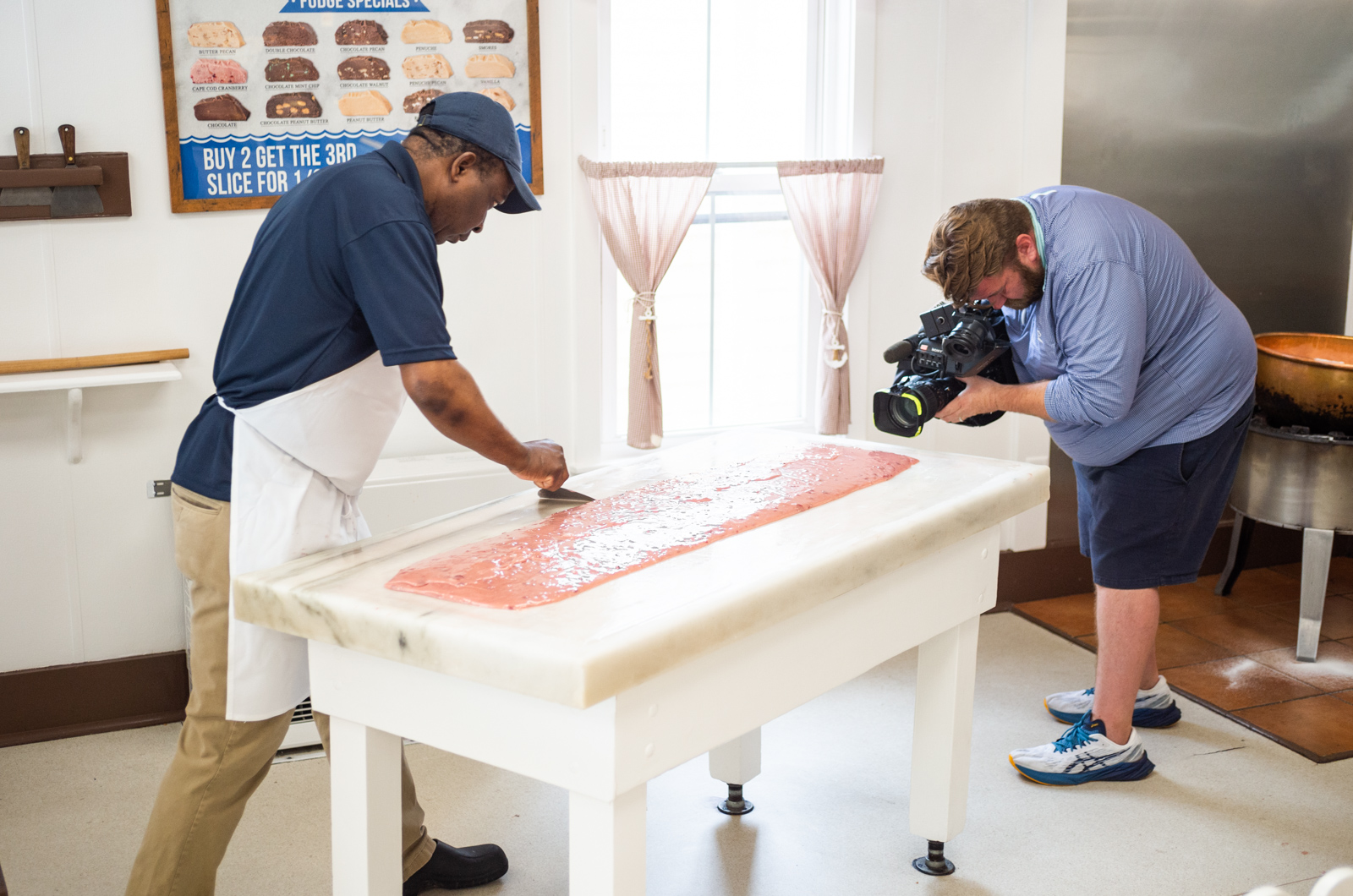 Slowly, Recardo shapes the congealing mixture into a loaf shapes.