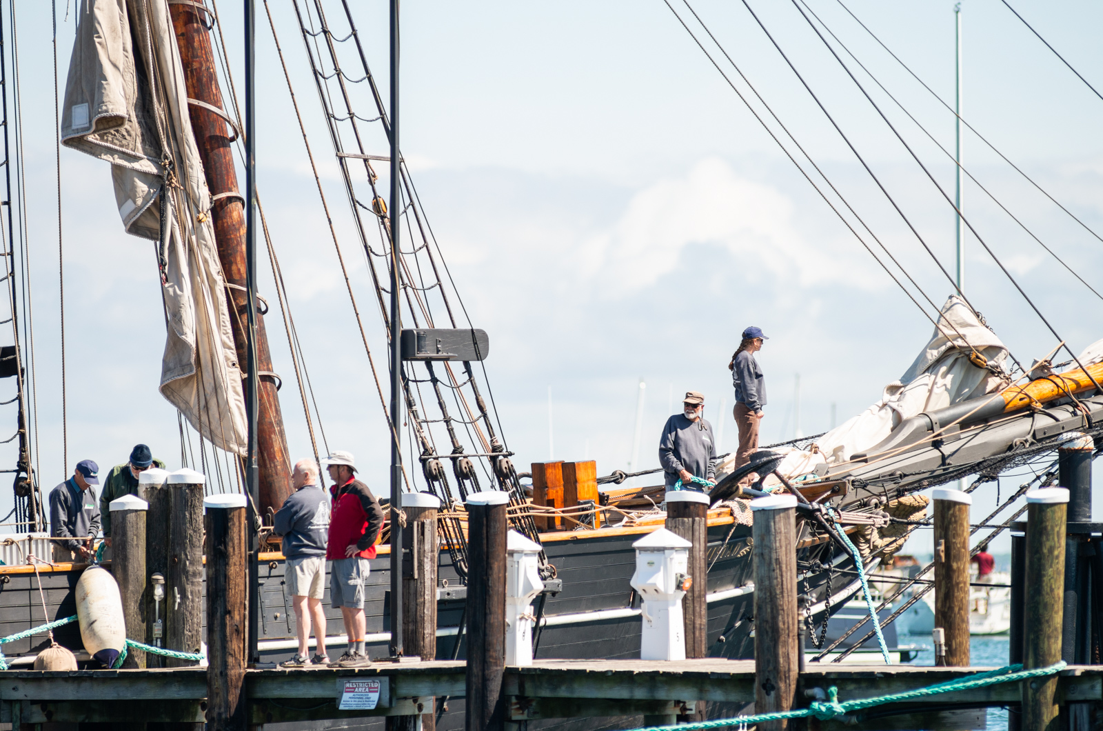 Crew members check on the ship.