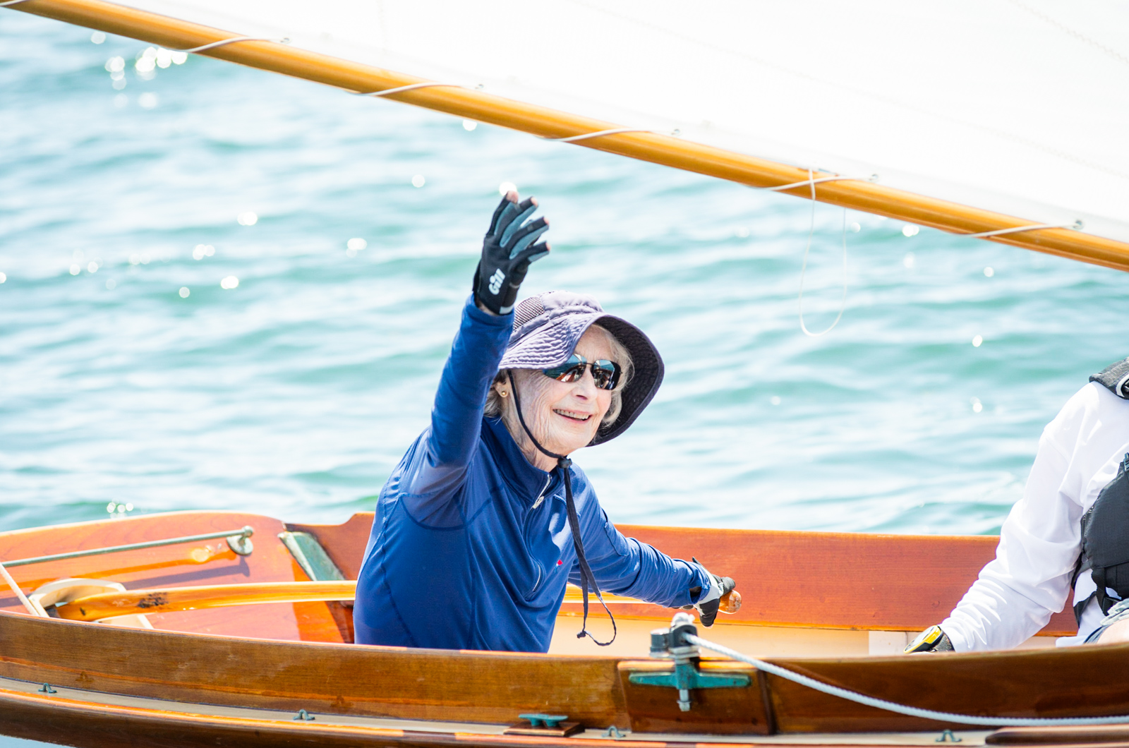 Dinny Dozier helps guide a Herreschoff class.