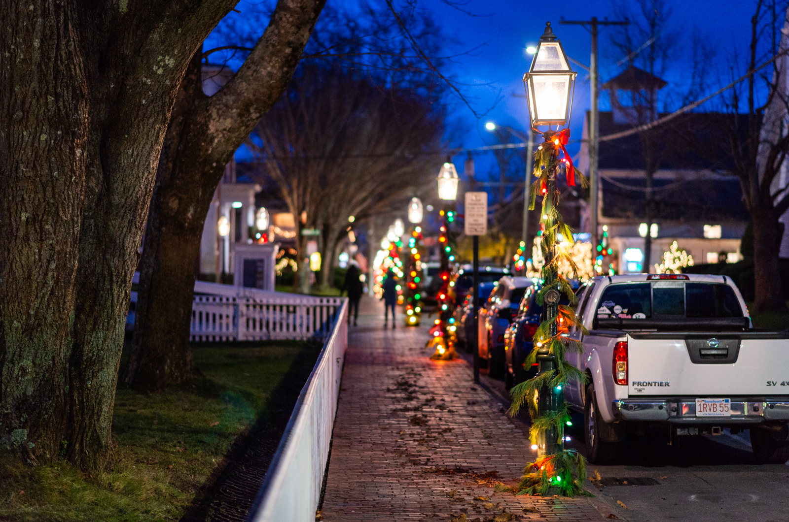 Main street is lined with trees and wrapped lamp posts.