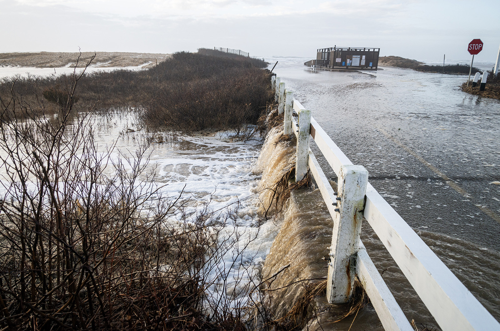 Floodwater running over Katama road into Herring Creek near the left fork entrance of South Beach.