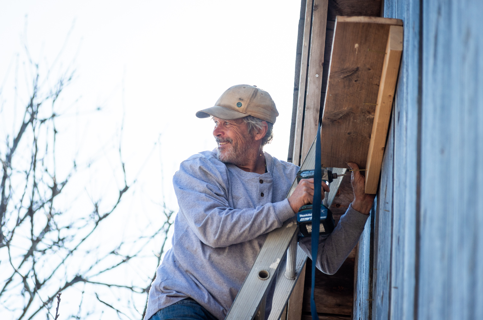 Andrew Woodruff installing a perch under the entrance.