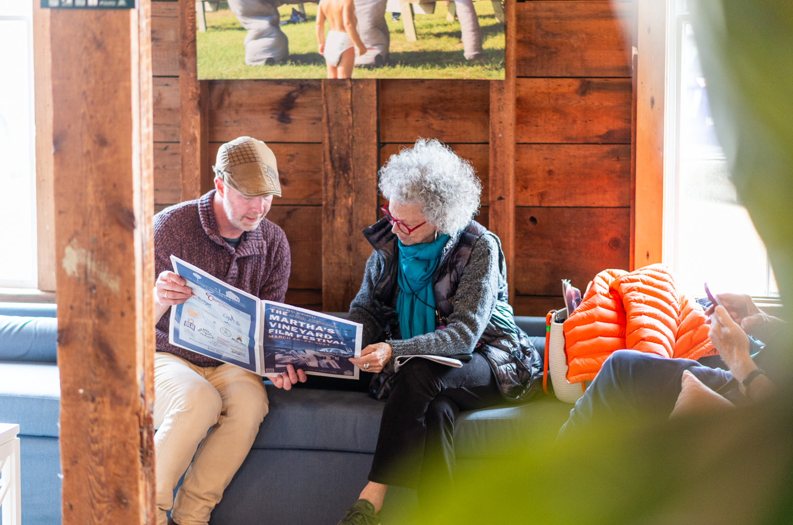 Brian Ditchfield (left) helps a guest with the festival schedule.
