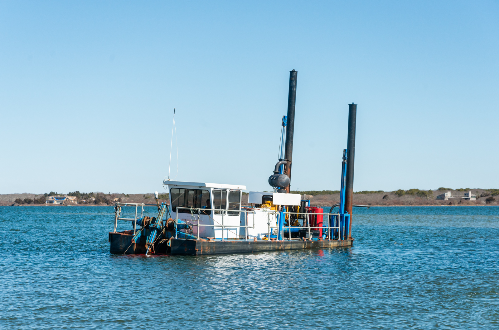 Dredge in Edgartown Great Pond.