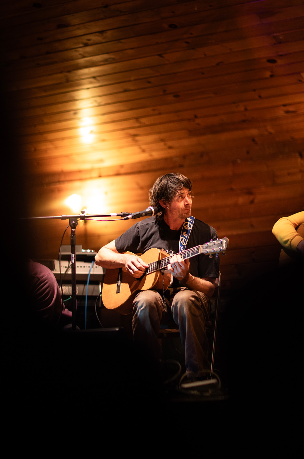 Isaac Taylor on acoustic guitar.