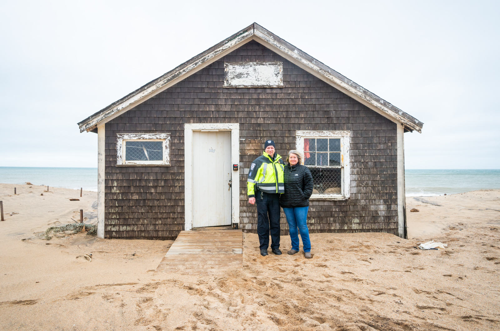 Joel DeRoche and Becky Donnelly in front of the Donnelly house.