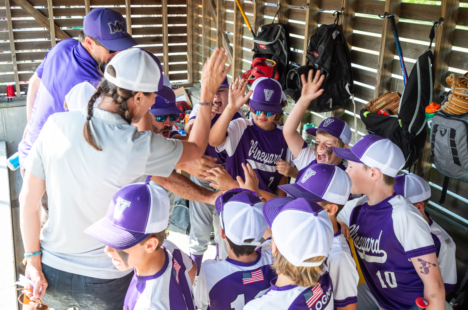 Coaches talk with players before the game.