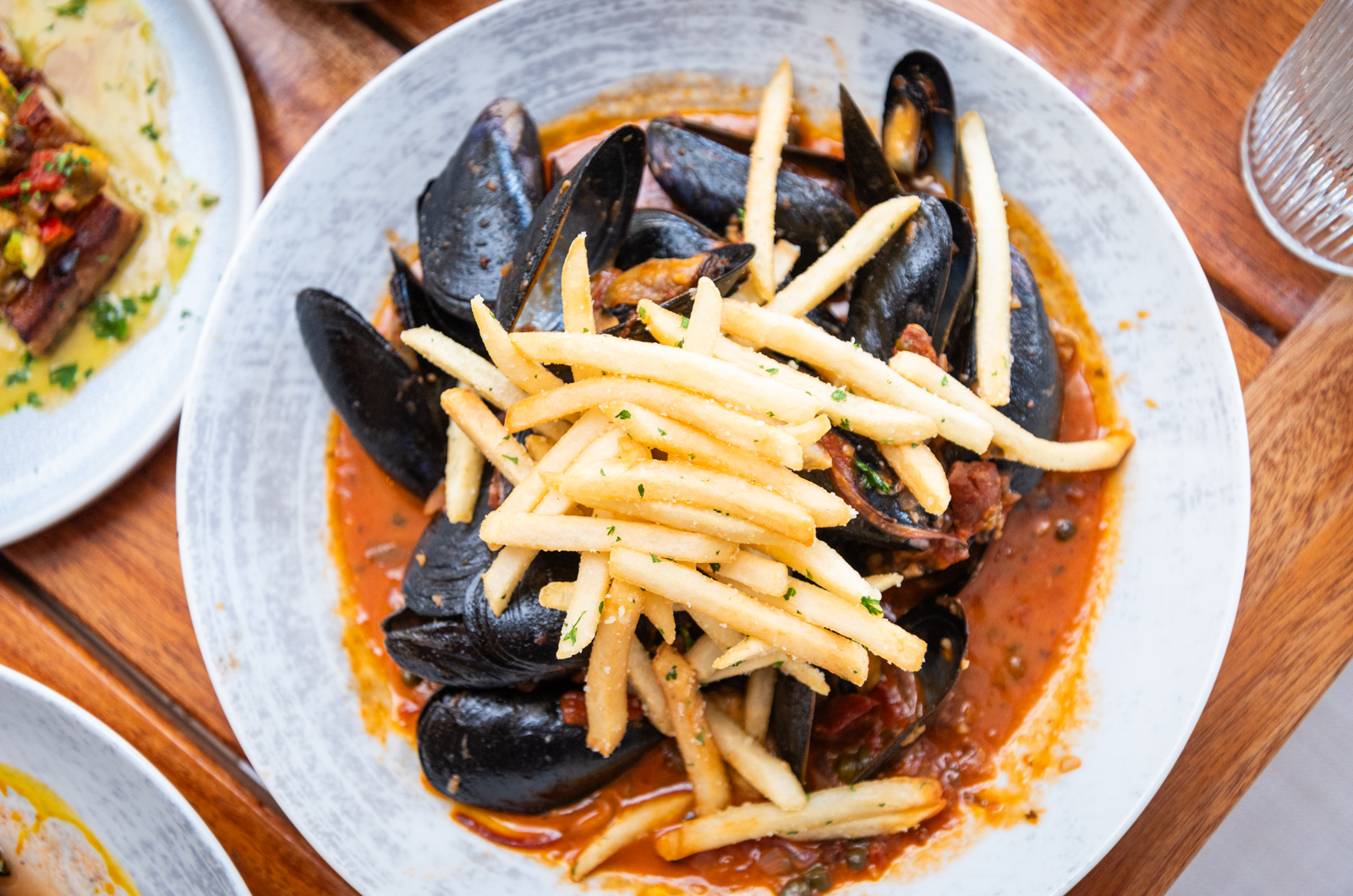 Mussels puttanesca with truffle fries at 9 Craft.