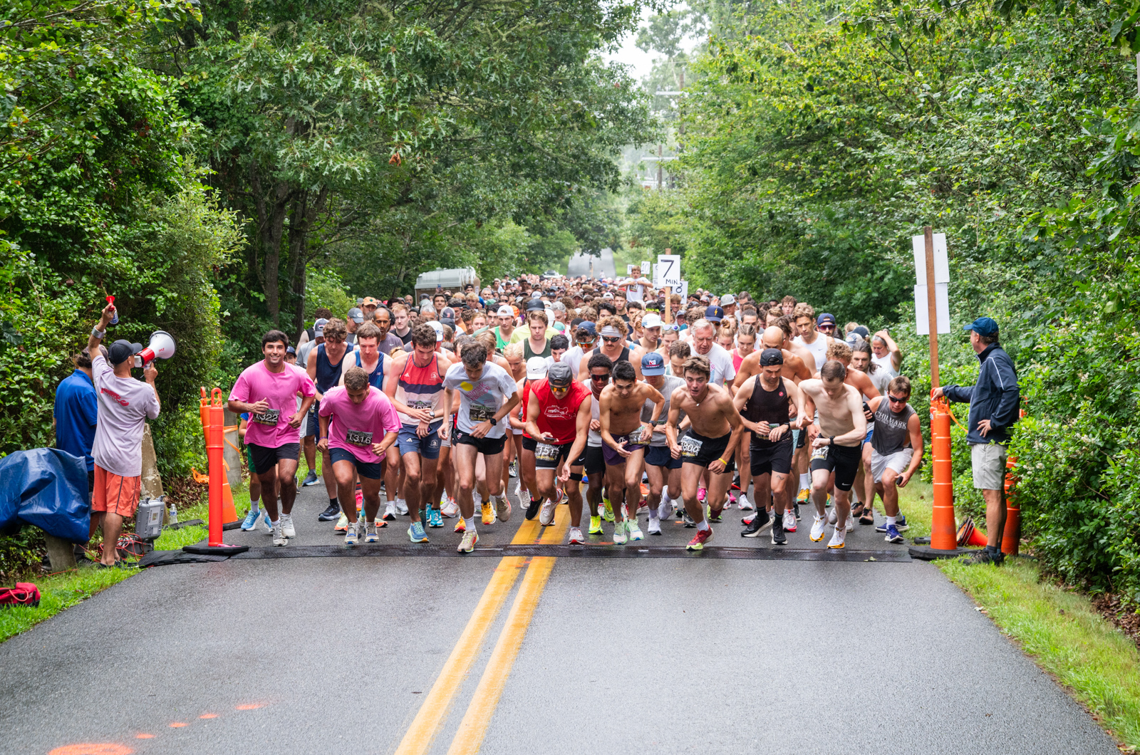 Runners take off at the start line.