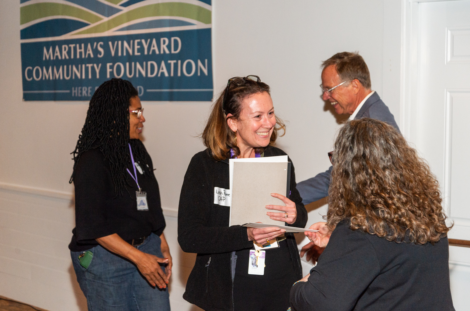 Leah Palmer of CAP receives a grant.