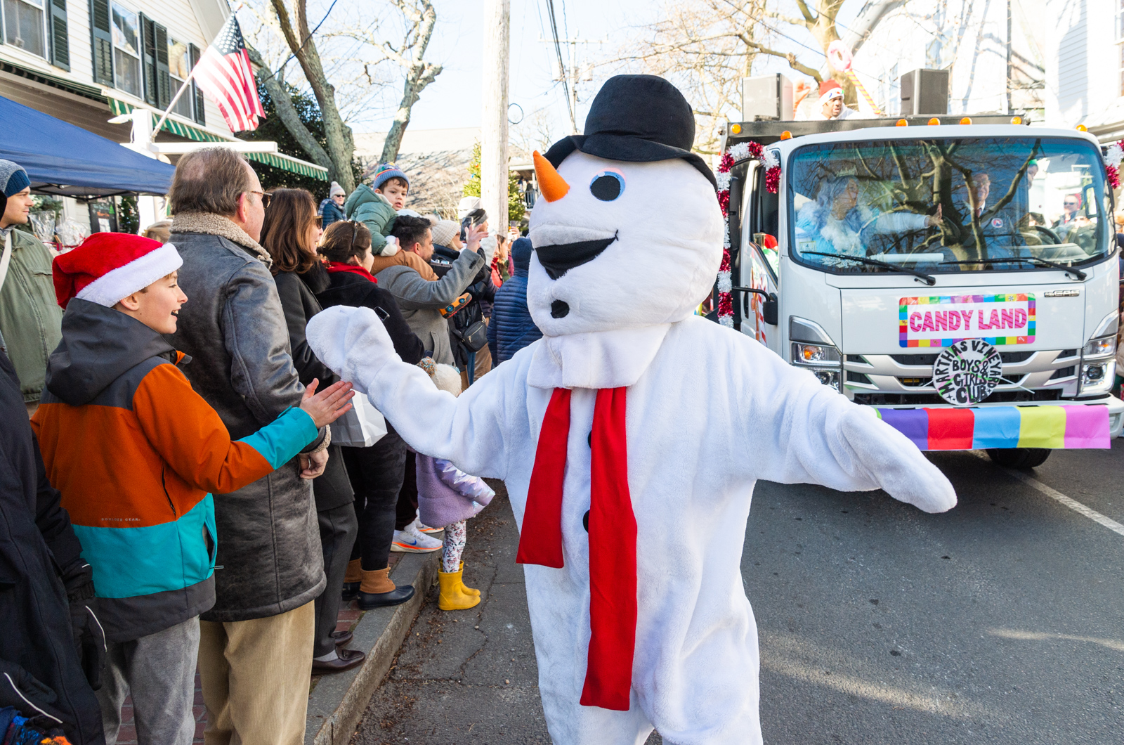 Frosty shakes hands and gives high-fives.