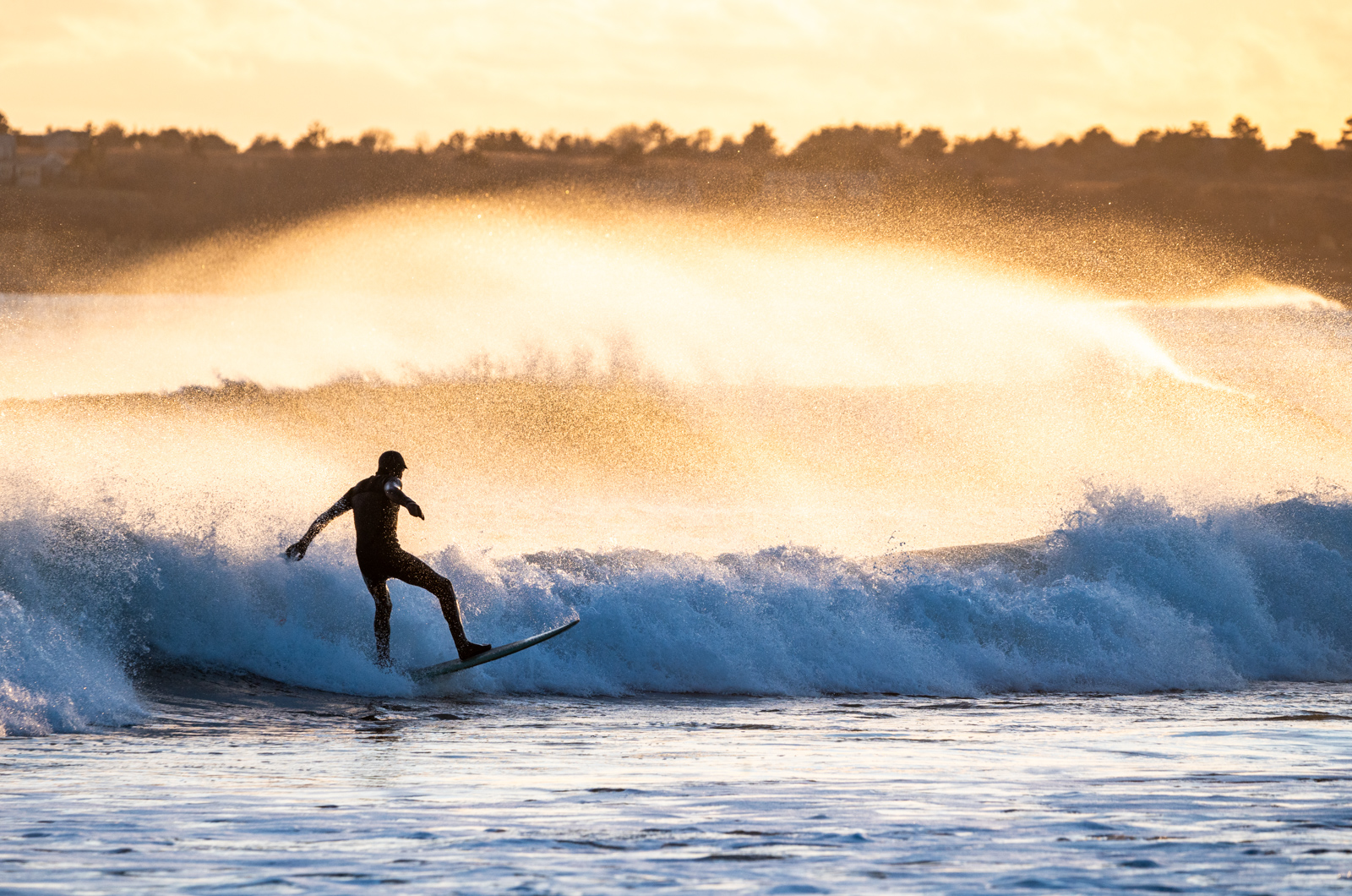 Jamie Greene surfing late in the day.