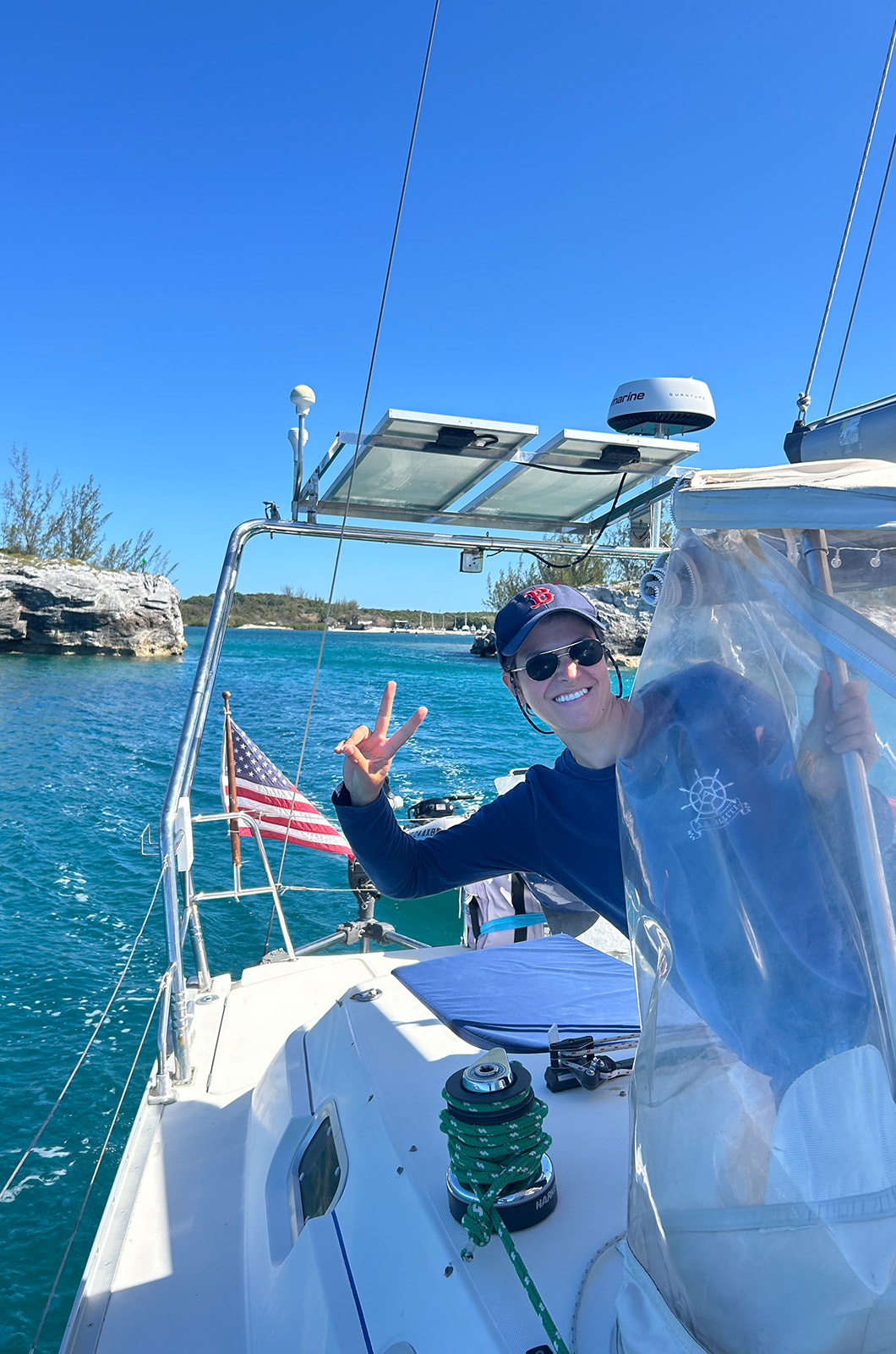 Enrica Jossi at the helm leaving Hatchet Bay in the Bahamas.