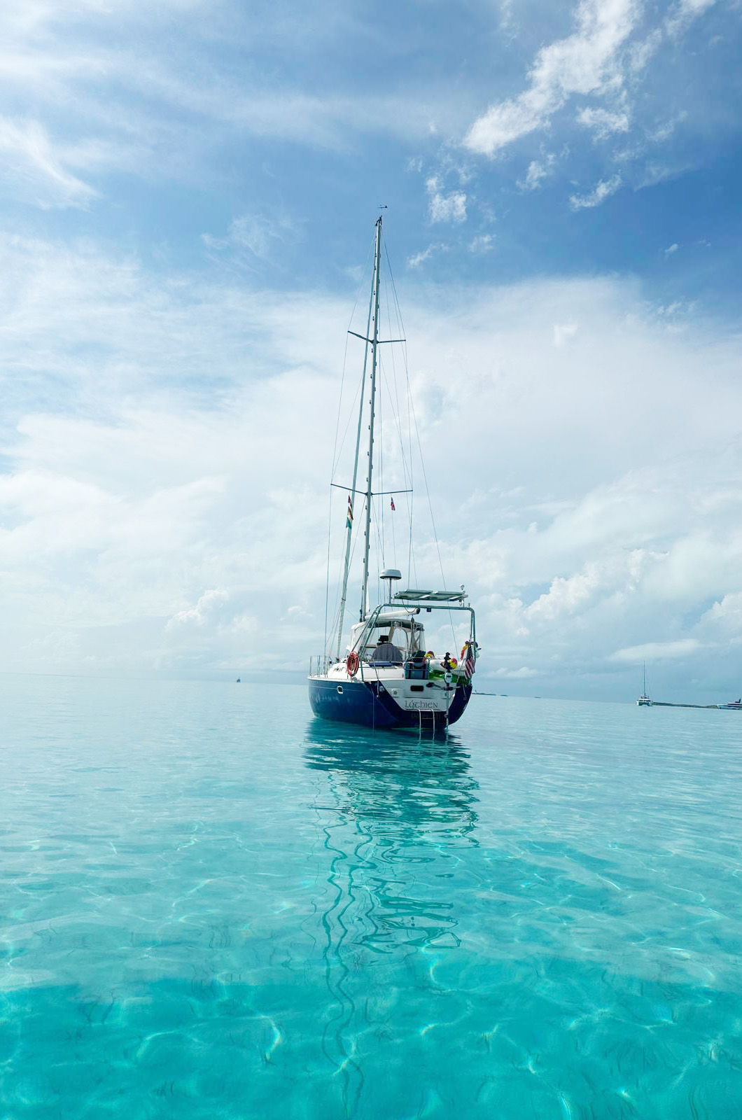 Lúthien anchored in a tropical bay.