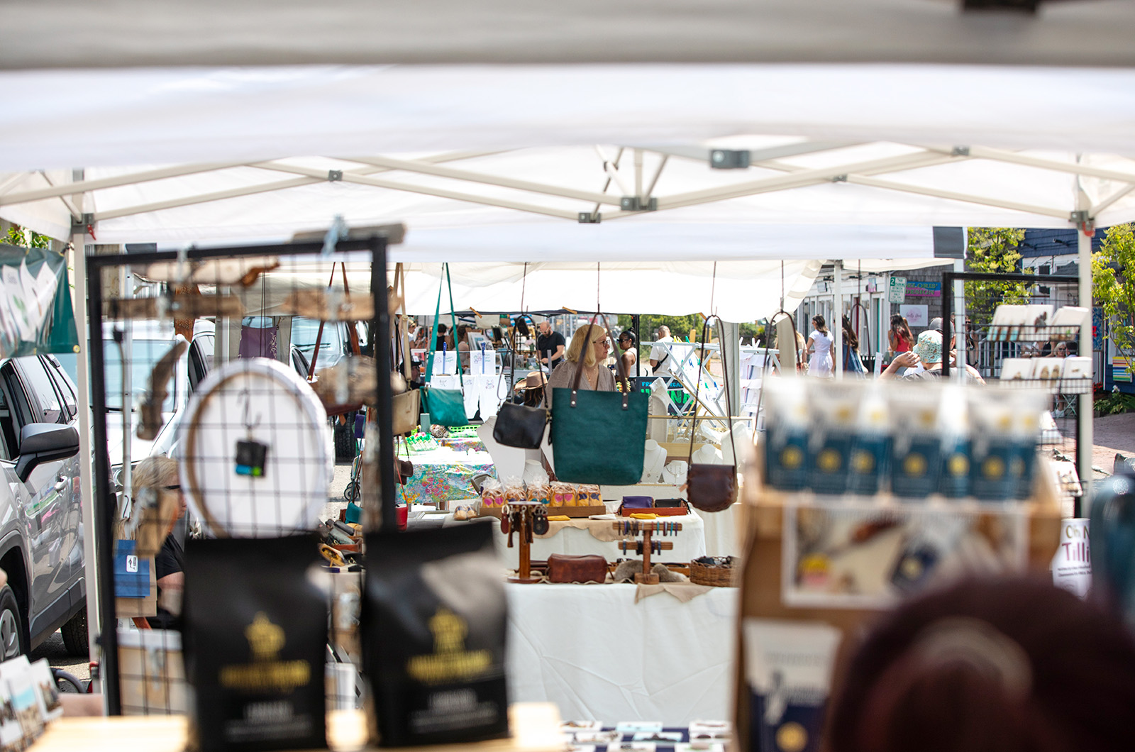 Vendors line the street selling art and crafts.