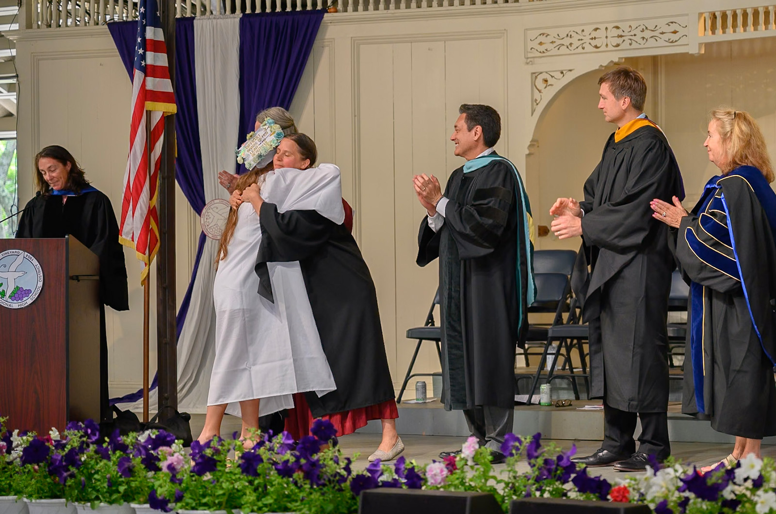 Sara Dingledy hugs a student.