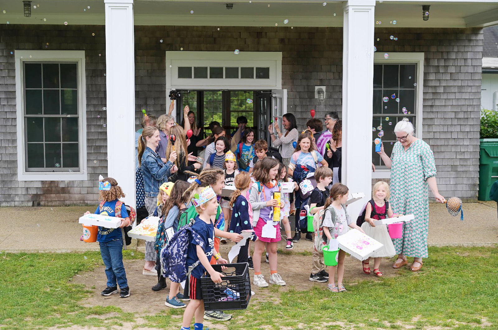 Chilmark school students spill out onto the lawn.