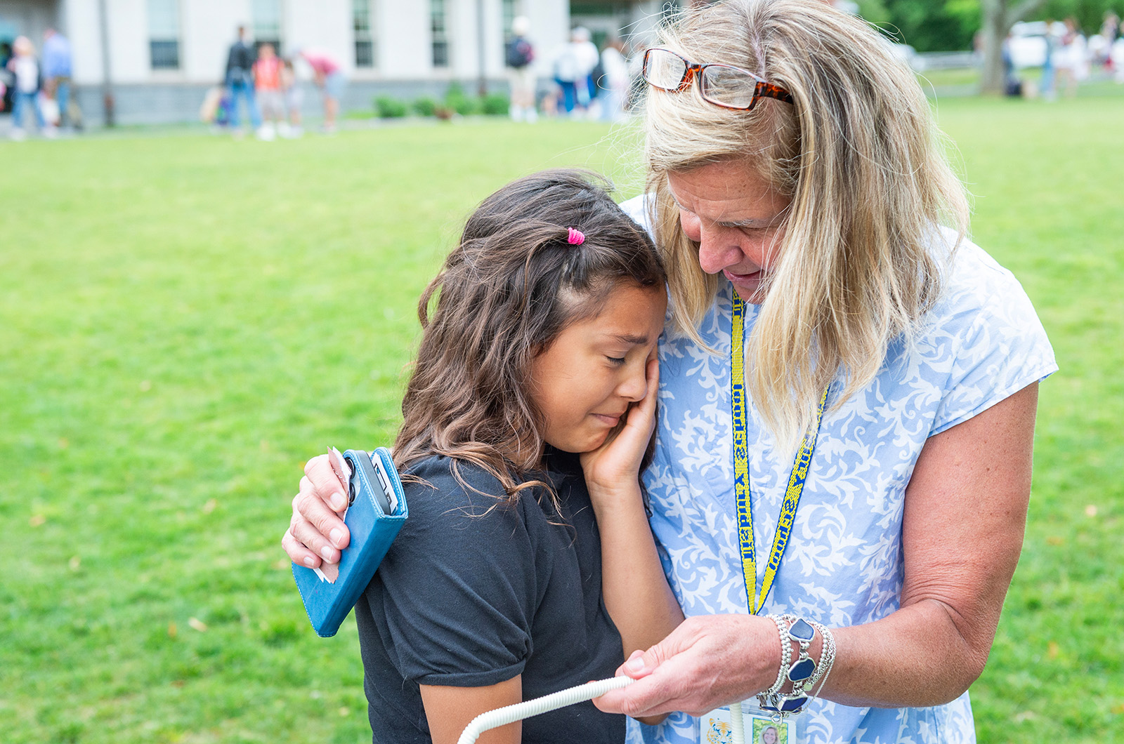 Brielle Cortez says goodbye to her teacher Anne Williamson who is retiring this year.