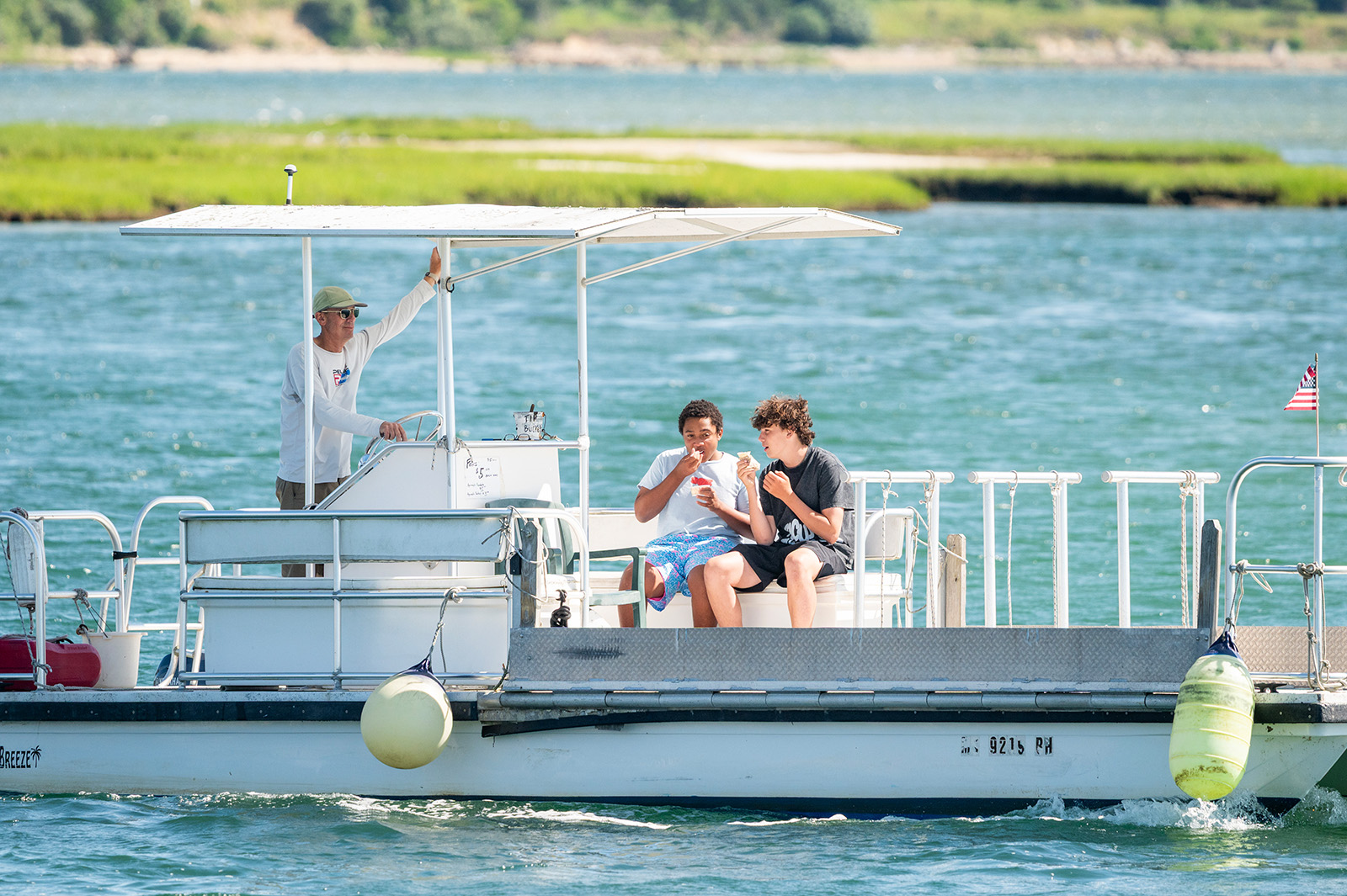 Sean McGowan brings Leo Russell and Luca Rotondi across on the bike ferry.
