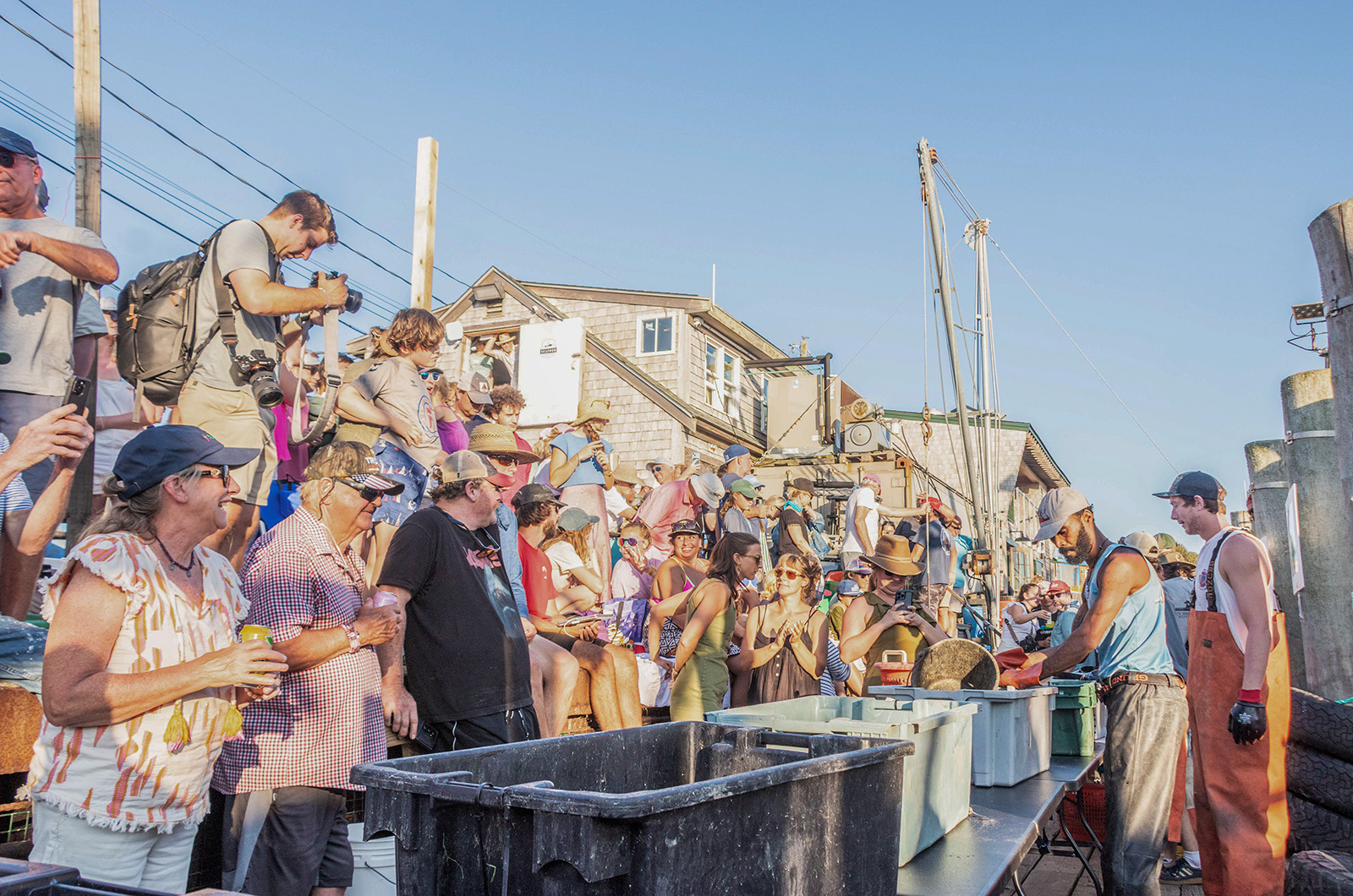 Crowds gather to watch the shucking competition.