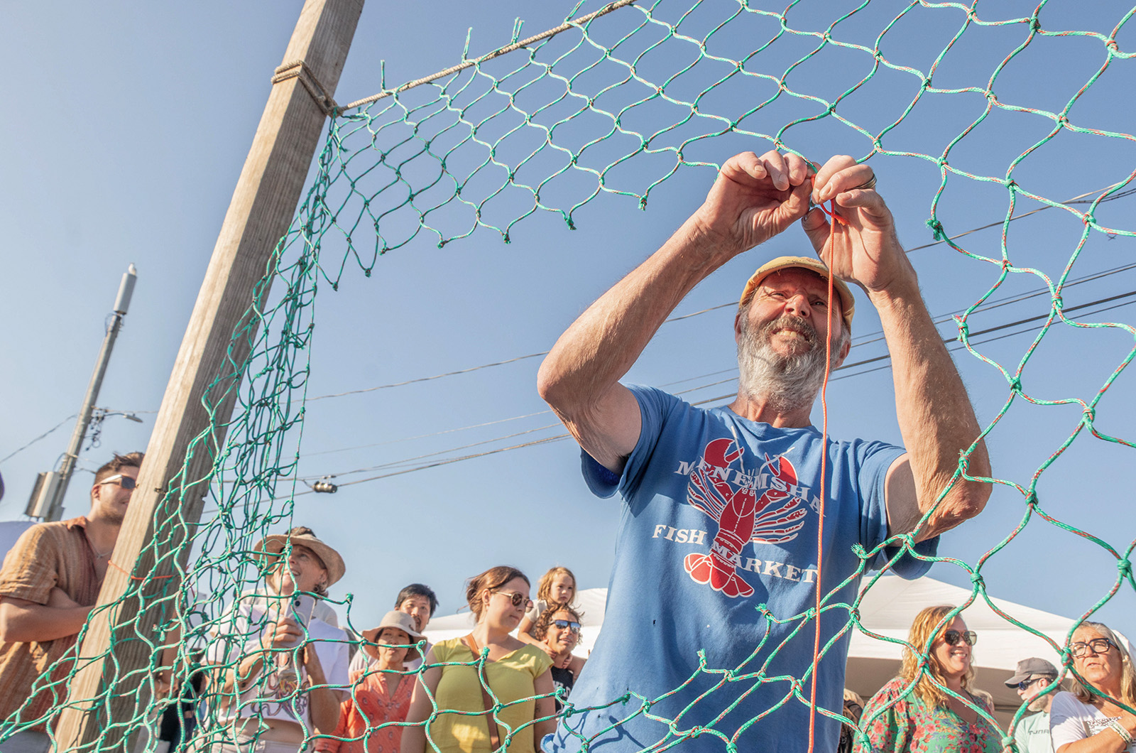 Stanley Larsen mending a net.