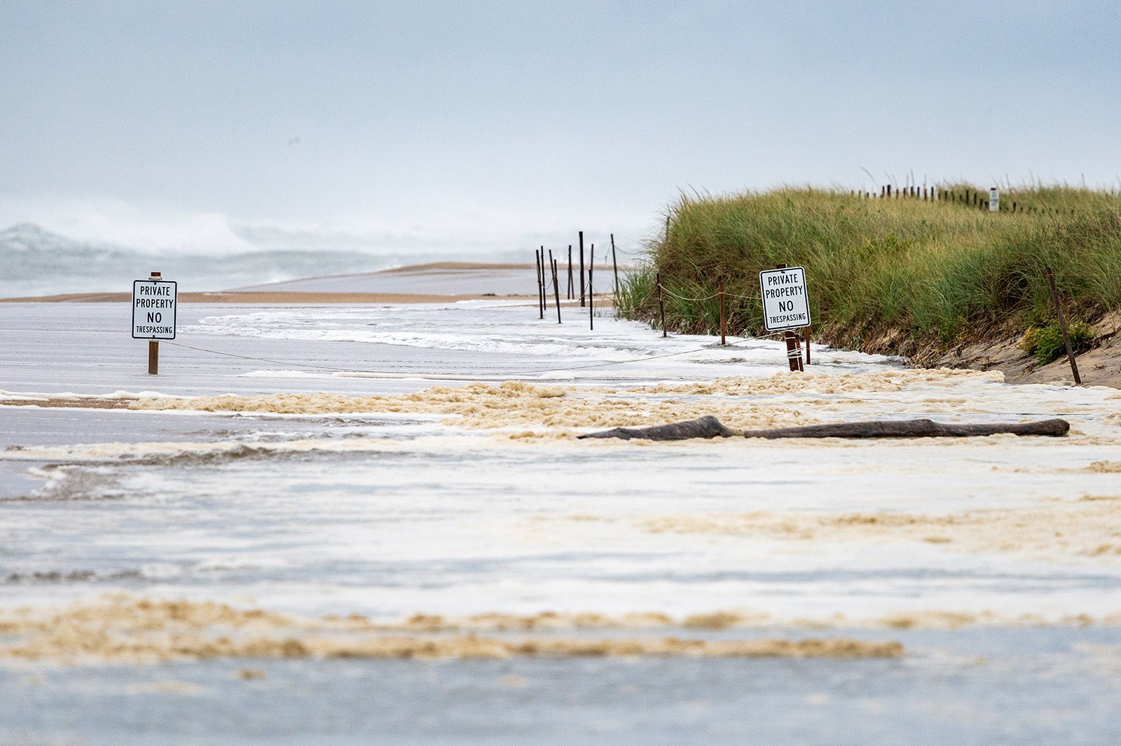 Heavy surf floods onto beach.