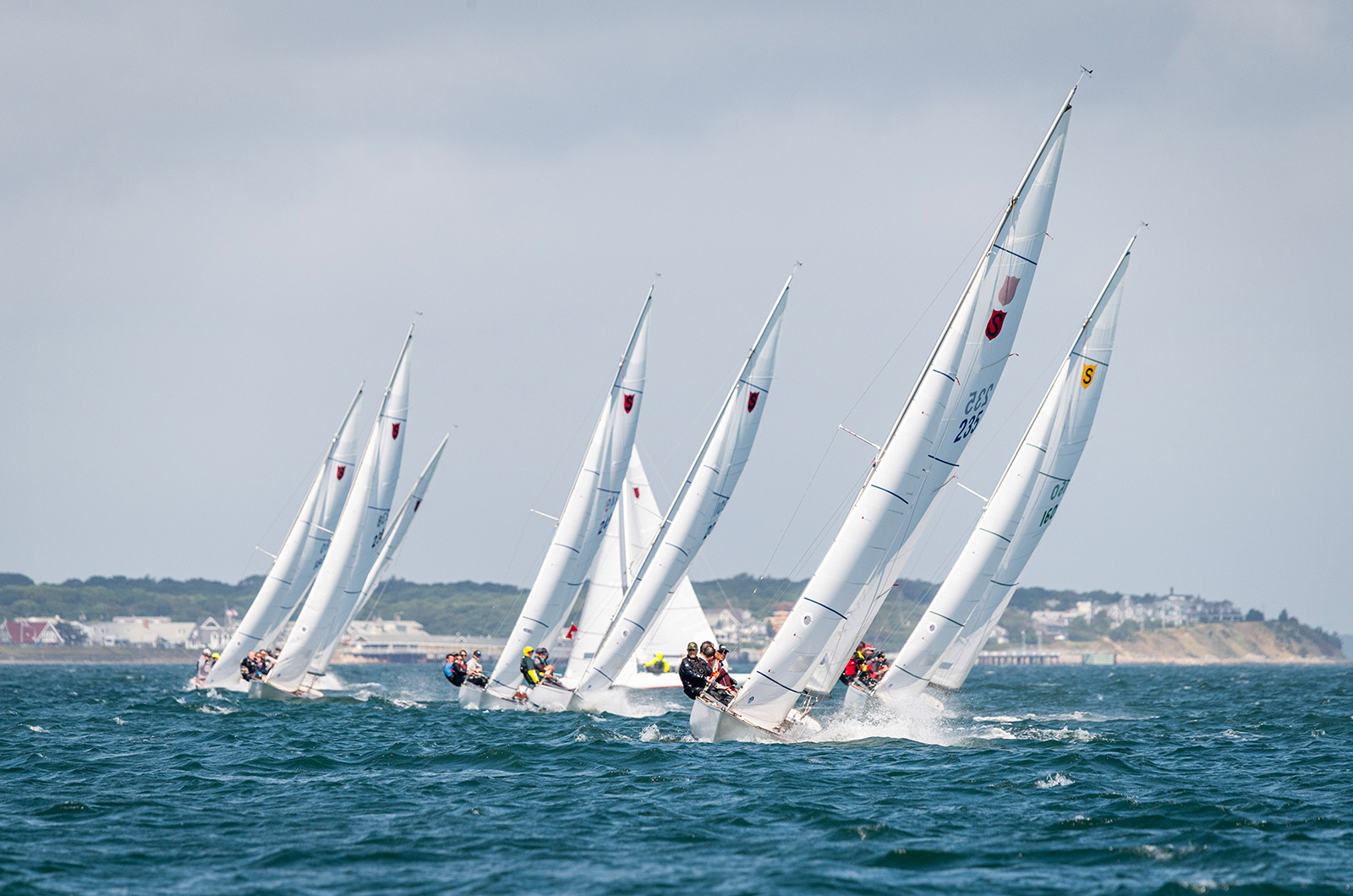 Group of teams approach the marker in tight formation.