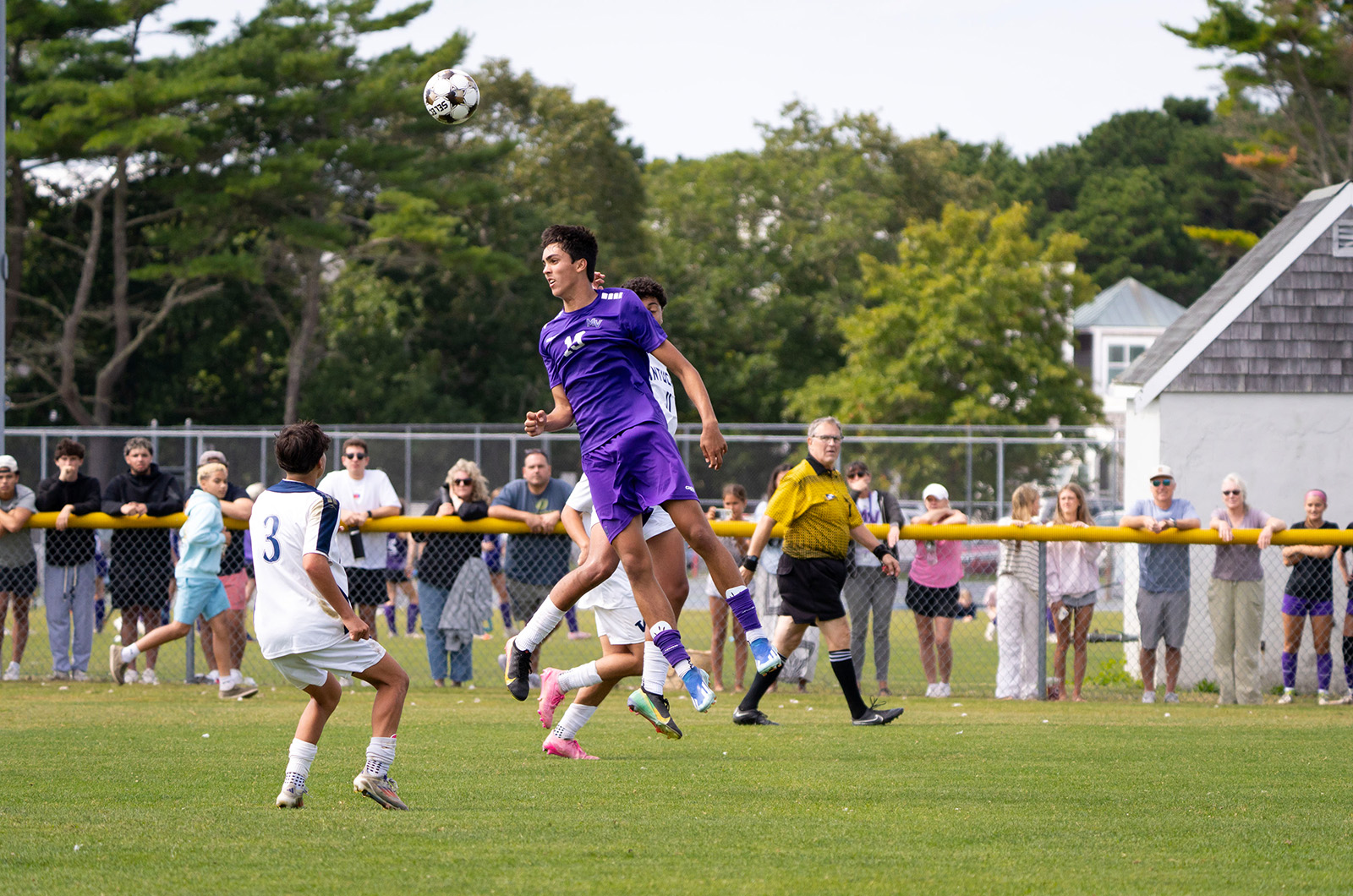 Moses Thomson gets a head on the ball.