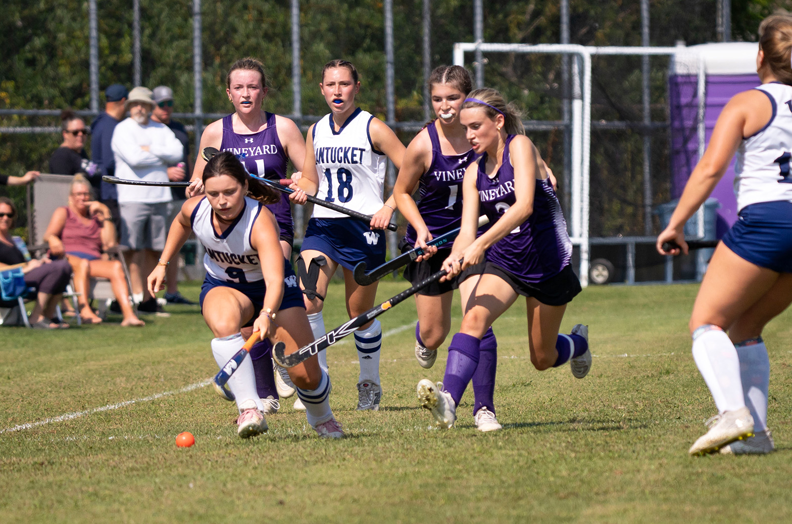 Chasing the Nantucket player down the sideline.