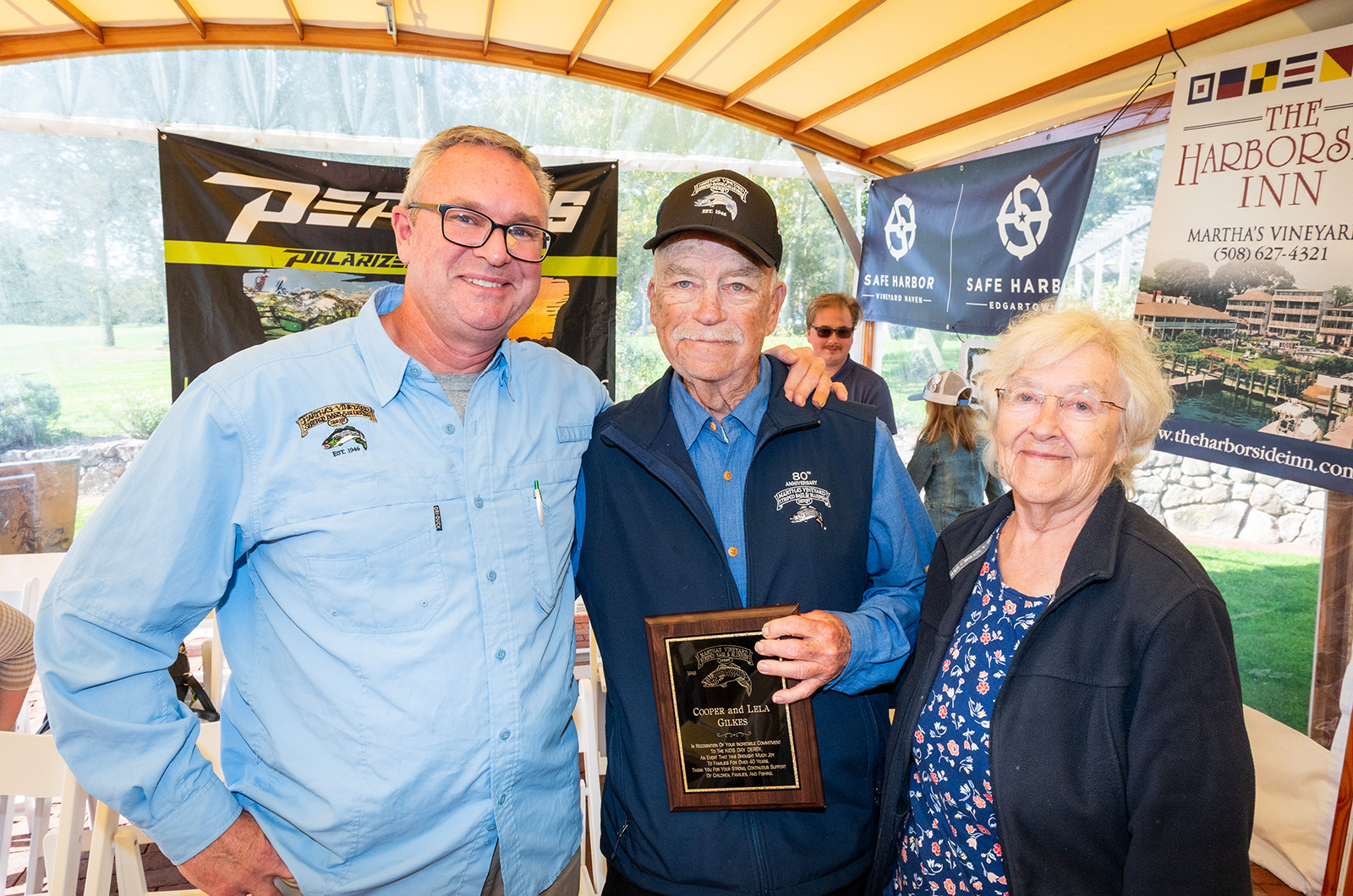 John Custer shares an award with Cooper and Lela Gilkes.