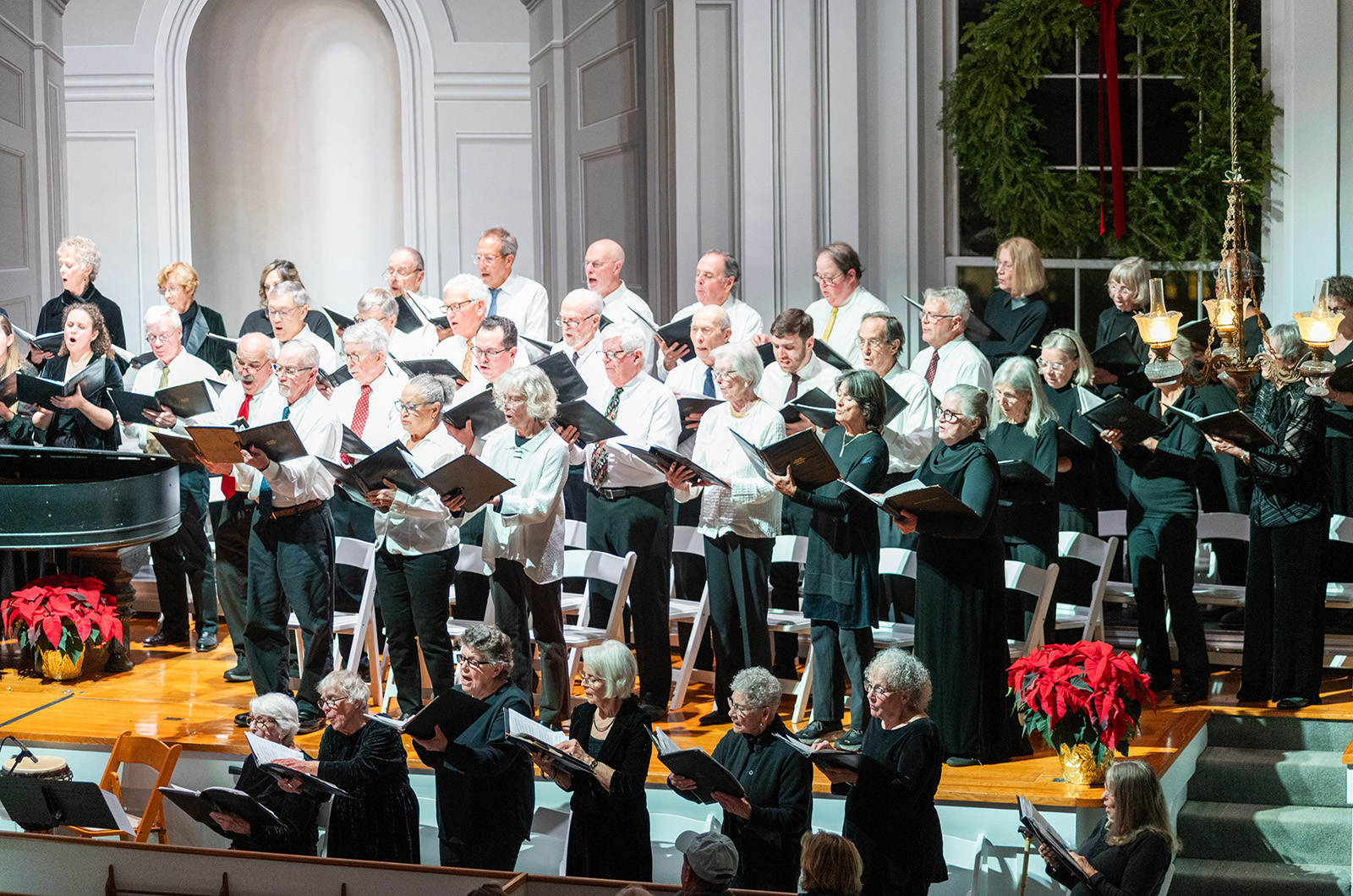 The stage overflowed with singers and instruments.