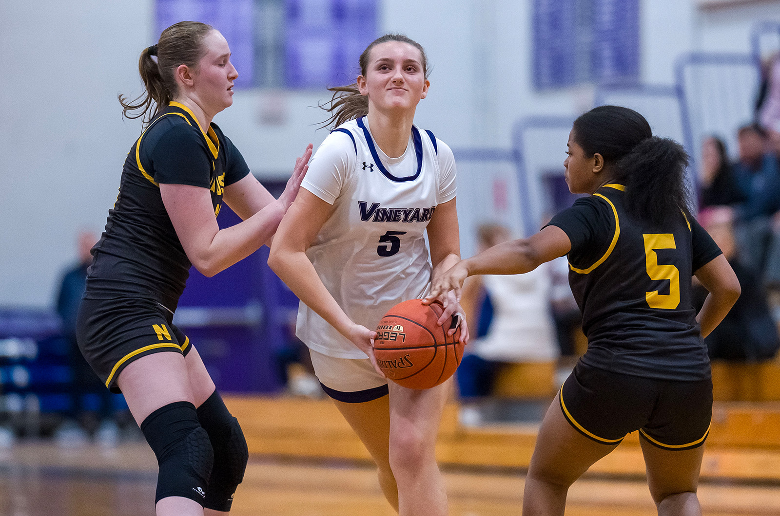 Olivia McCormick pushes through Nauset defenders.