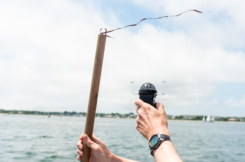 Michael Balay (scorer) testing wind direction.