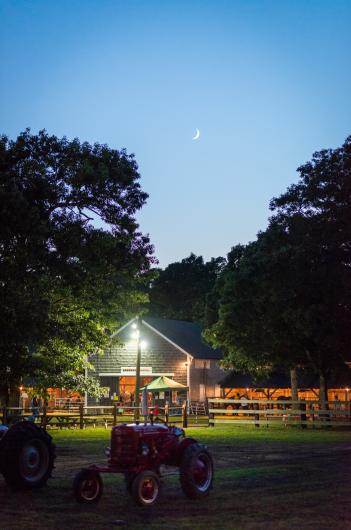The moon rises over the fair.