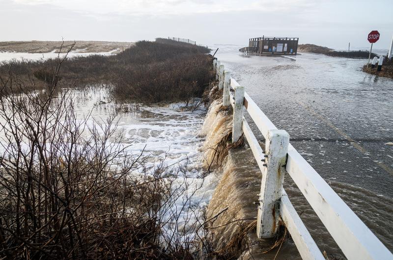 Floodwater running over Katama road into Herring Creek near the left fork entrance of South Beach.