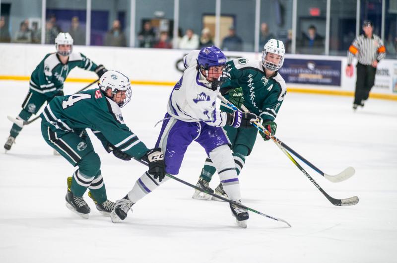 Hunter Johnson breaking through defenders.