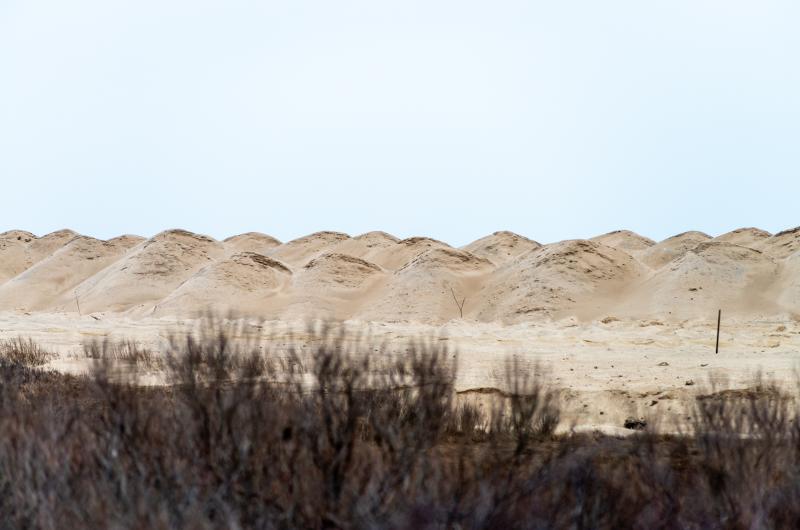 Piles of new sand placed along the entrance to Norton Point.