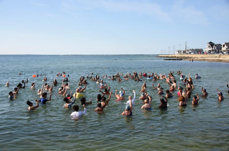 Swimmers join in on some calisthenics.