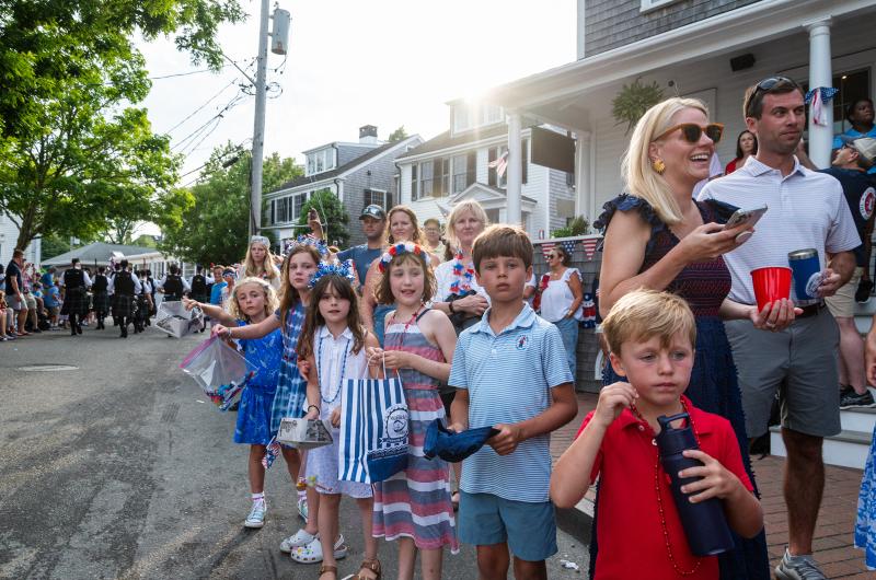Kids line Water street waiting for candy.