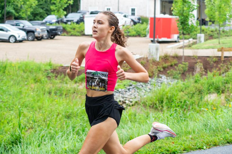 Lilly Tuck (1st Woman) nears the finish line.