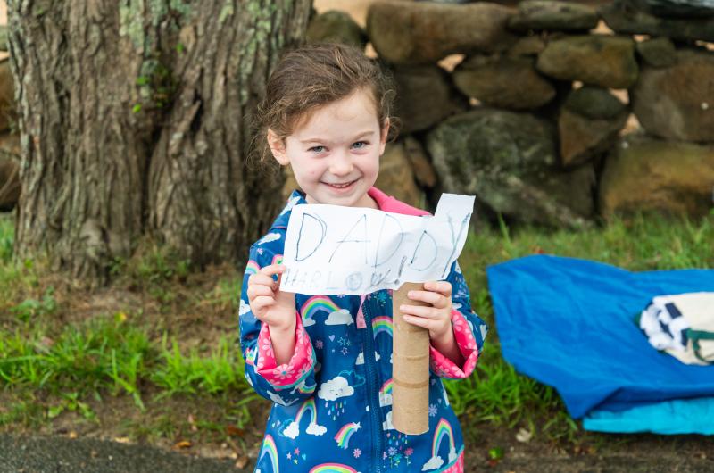 Harlow Rose Sullivan with a homemade sign for her dad.