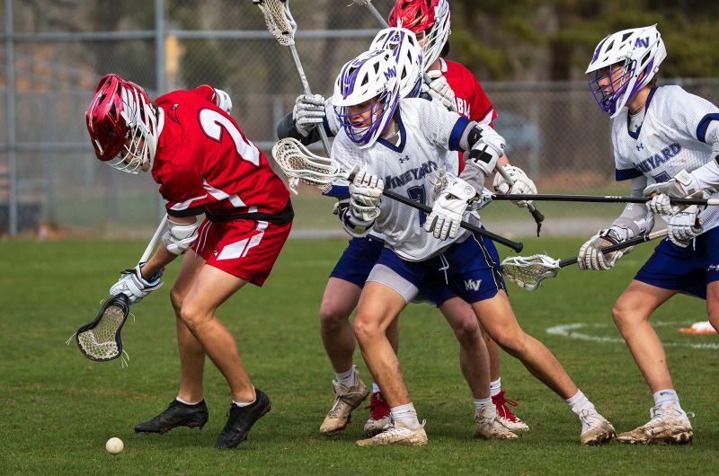 MVRHS Lacrosse players play defense.