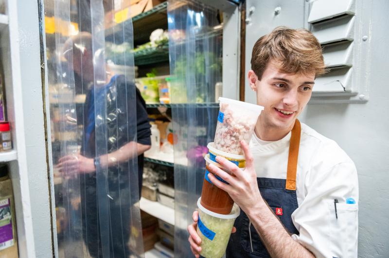 Ryan Scanlon getting ingredients from the freezer.