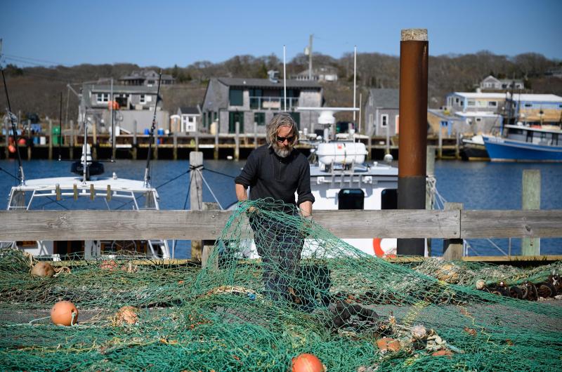 Todd Mayhew with Menemsha harbor behind him.