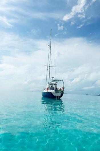 Lúthien anchored in a tropical bay.