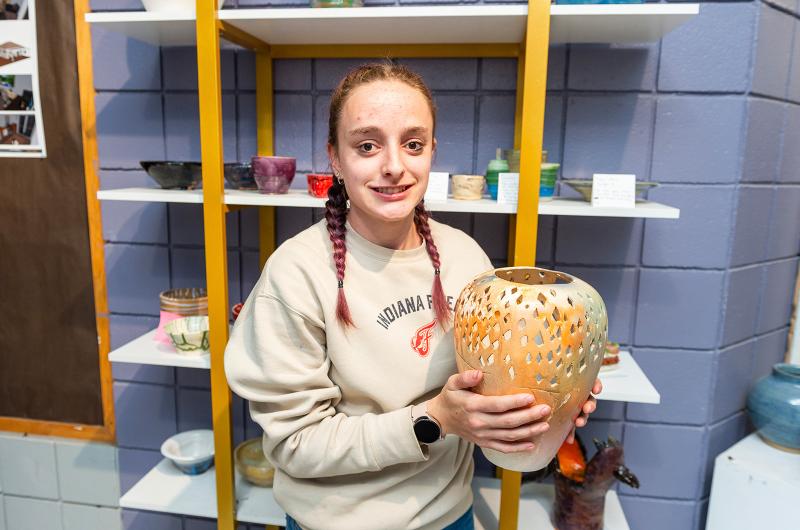 Isabella Burns with her pottery piece.